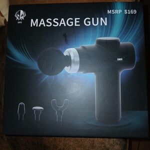 Sleek Black Massage Gun with Versatile Attachments